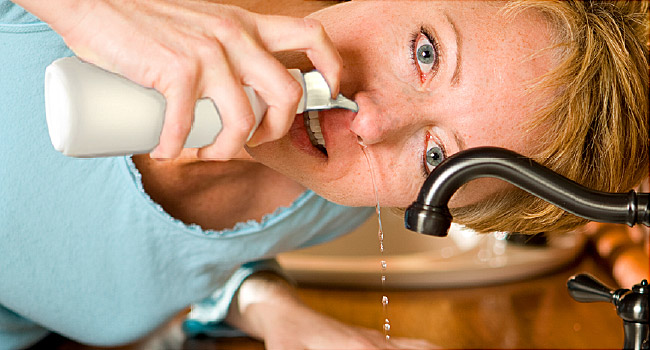 woman doing nasal cleanse