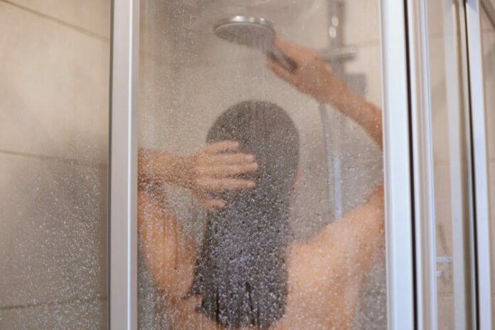 enjoying-shower-back-view-beautiful-young-slim-shirtless-woman-taking-shower-washing-hair-bathroom-hygiene-healthy-beauty-indoor-shot-750x500 (1)